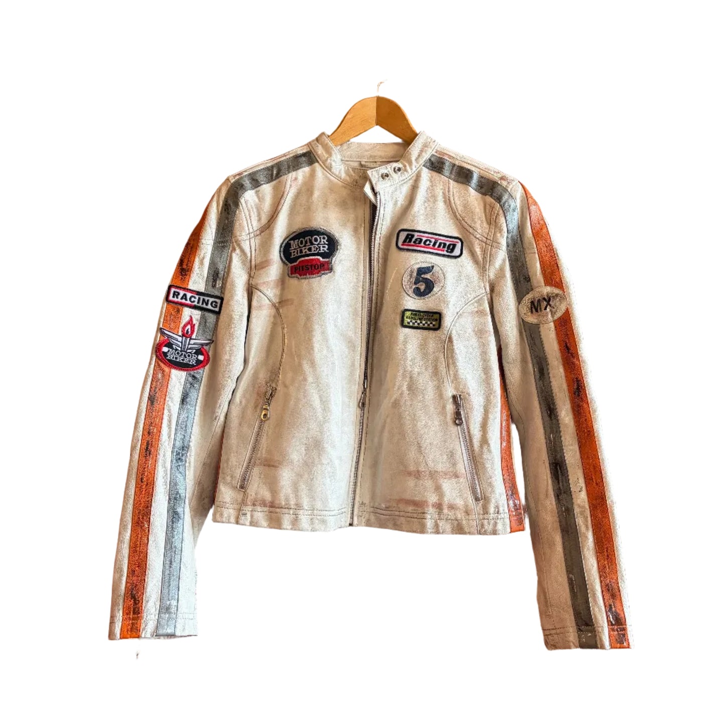 Vintage racing jacket with patches on a hanger against a brick wall