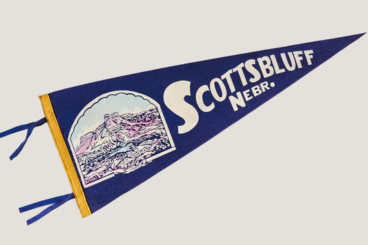 Vintage-style pennant with 'Scottsbluff Nebr.' text on a white background