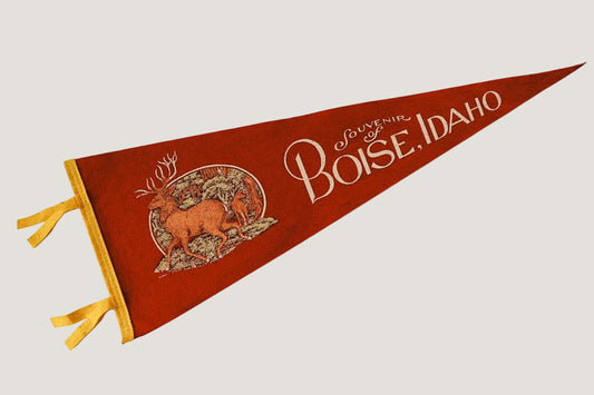 Red and gold vintage-style pennant with 'Boise, Idaho' text on a white background