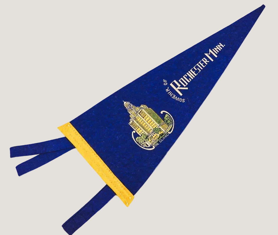 Blue and yellow pennant with 'Rochester' logo on a white background