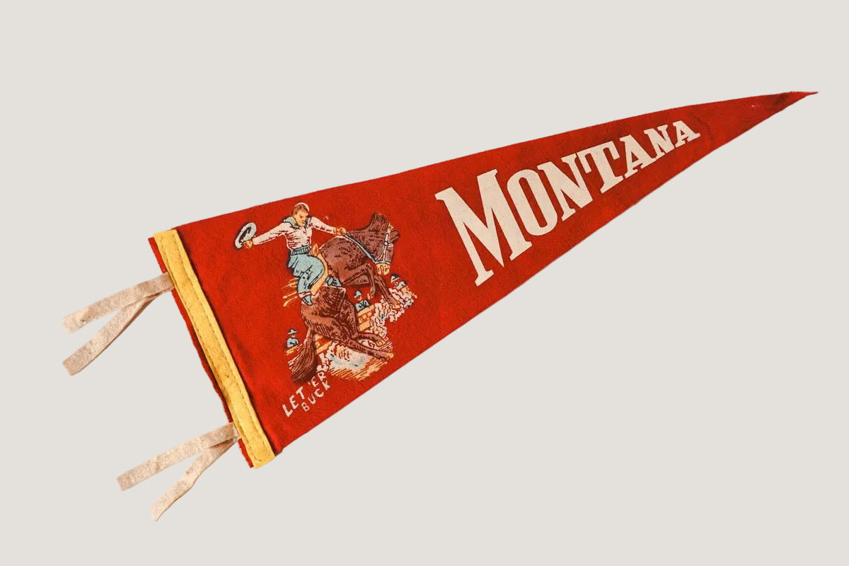 Red and gold vintage-style pennant with 'Montana' text on a white background