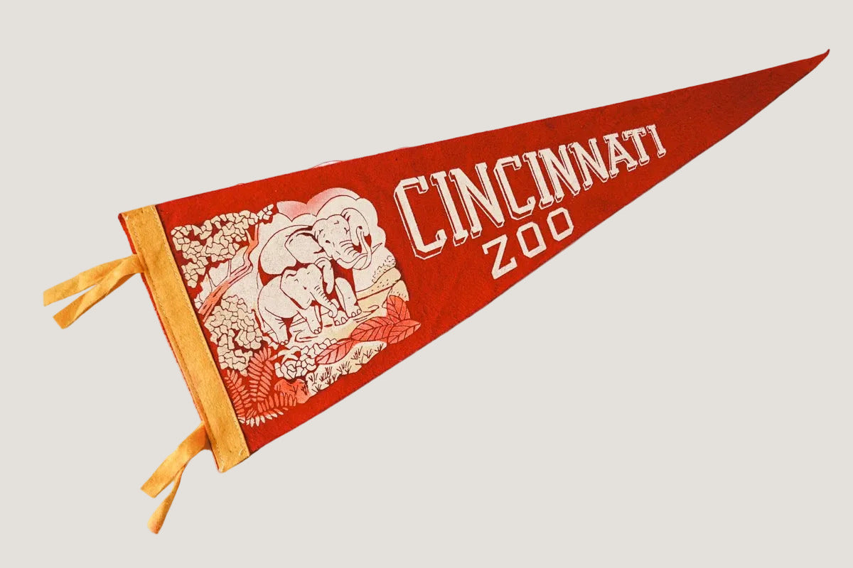 Red Cincinnati Zoo pennant with elephant design on a white background