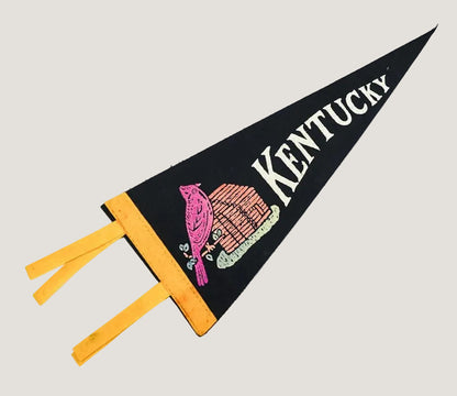 Kentucky-themed pennant with a heart and yellow tassels on a white background