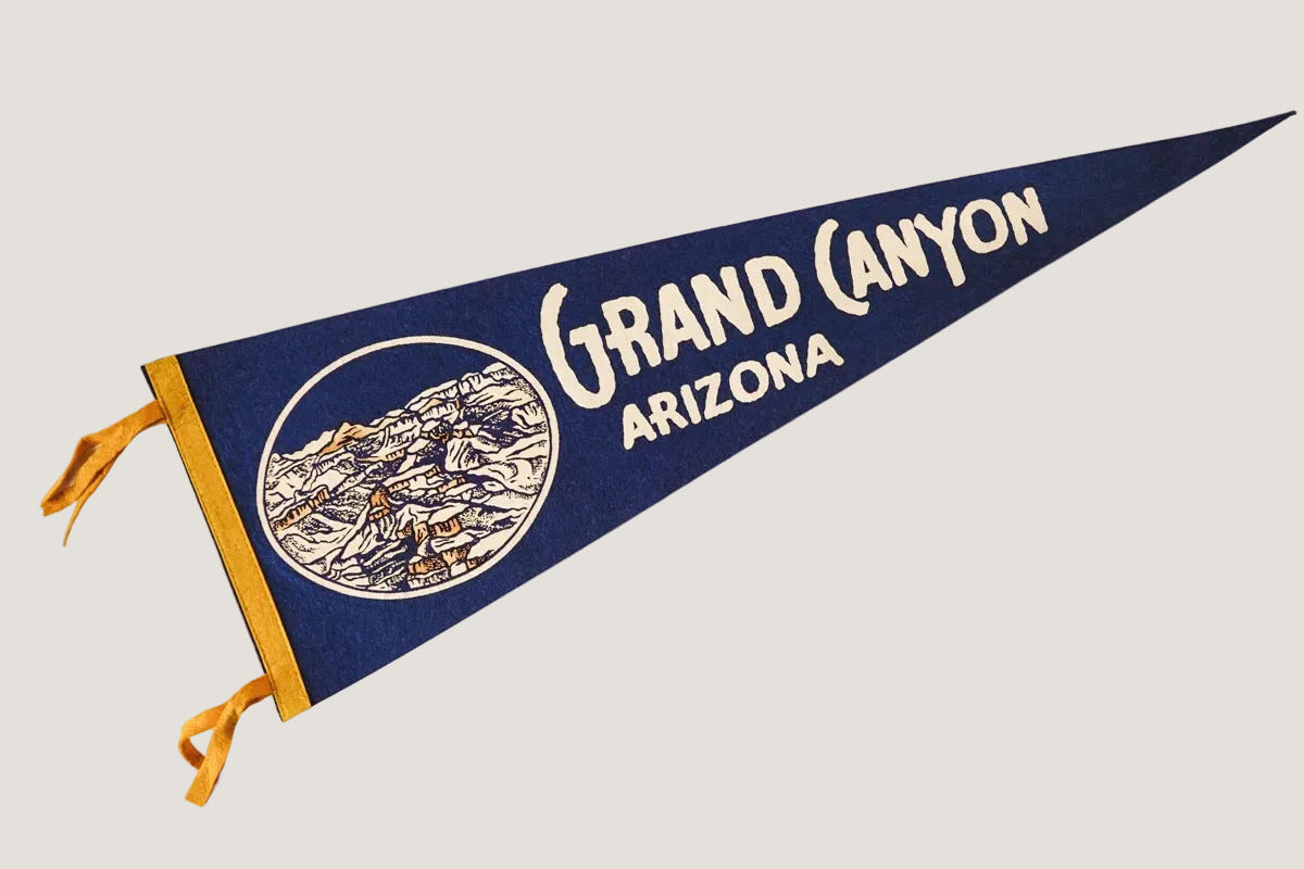 Pennant with 'Grand Canyon Arizona' text on a white background