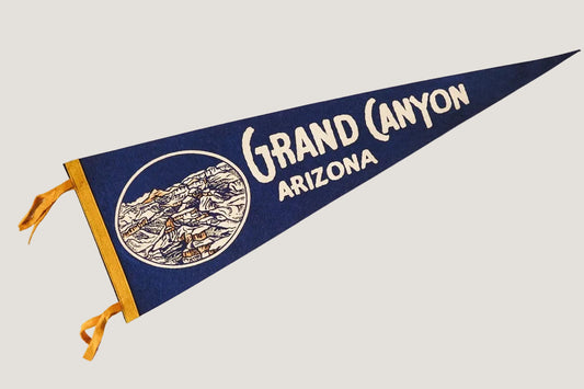Pennant with 'Grand Canyon Arizona' text on a white background