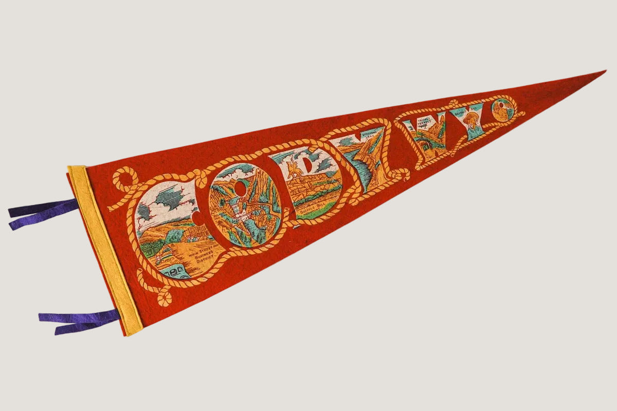 Decorative pennant with colorful designs on a white background