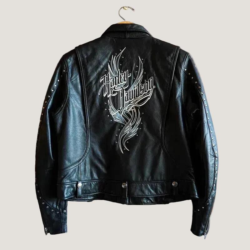 Black leather jacket with 'Harley Davidson' logo on a brick wall