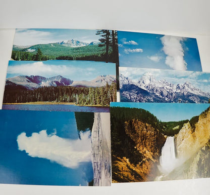 Collection of postcards with scenic landscapes including mountains, forests, and waterfalls.